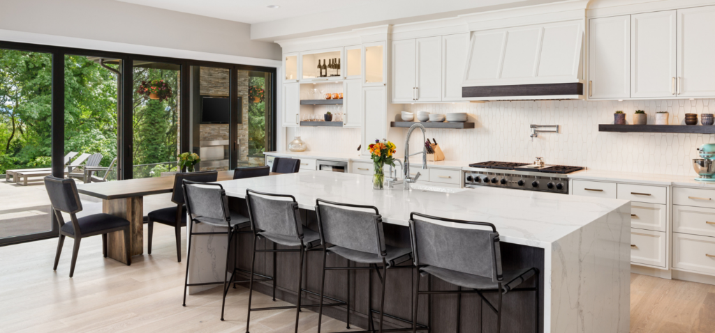White kitchen cleaned by residential cleaning team.